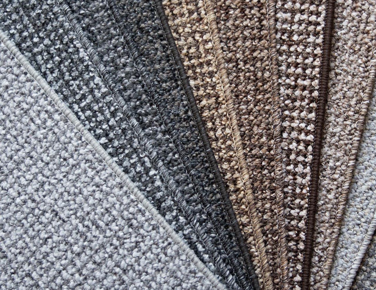 Carpet flooring samples in a range of colors and textures at Heart of Texas Flooring Brownwood TX showroom